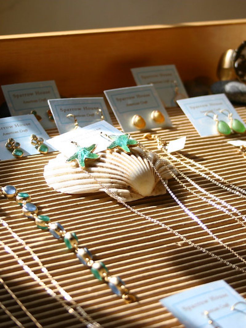 Jewelry in a gift shop display case.