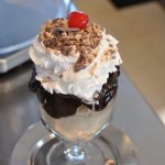 Vanilla Ice Cream Sundae with hot fudge and a cherry on top at Cabot's Ice Cream.