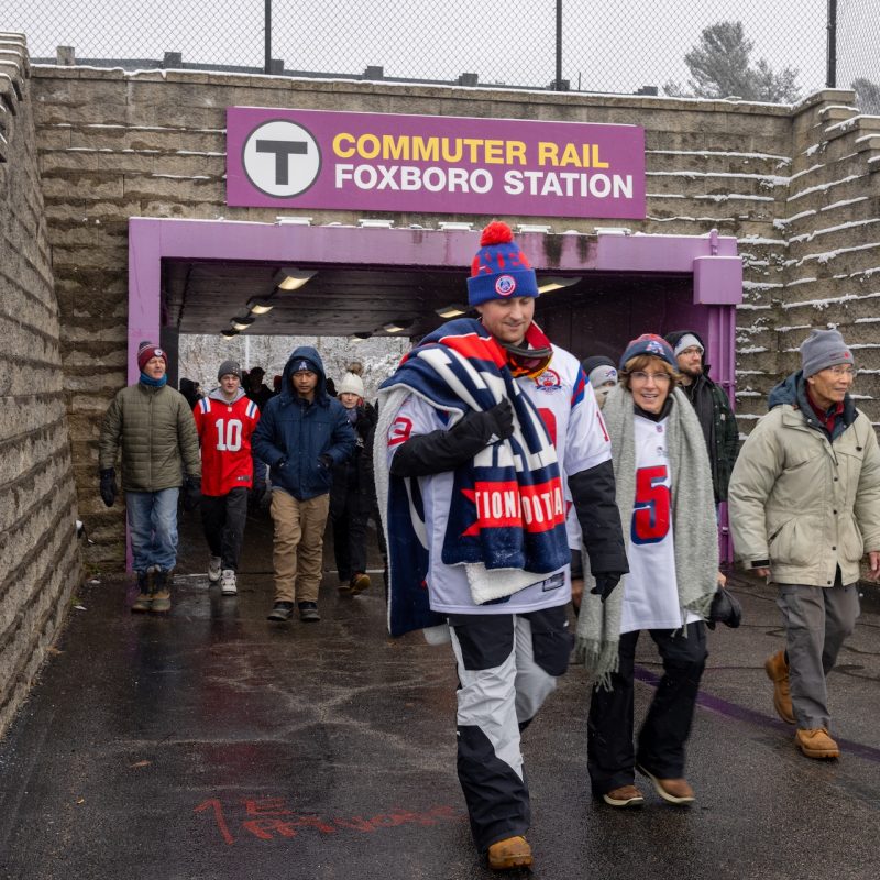 Patriots fan walking from Foxboro Commuter Rail Station to Gillette Stadium.