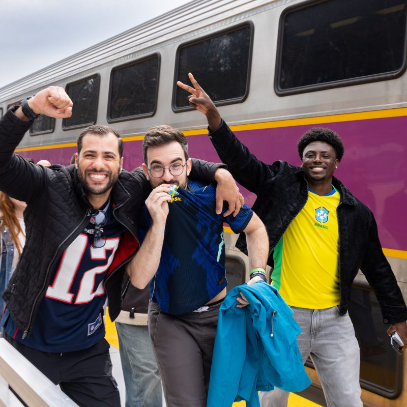 Soccer fans celebrating before entering the stadium to watch a match