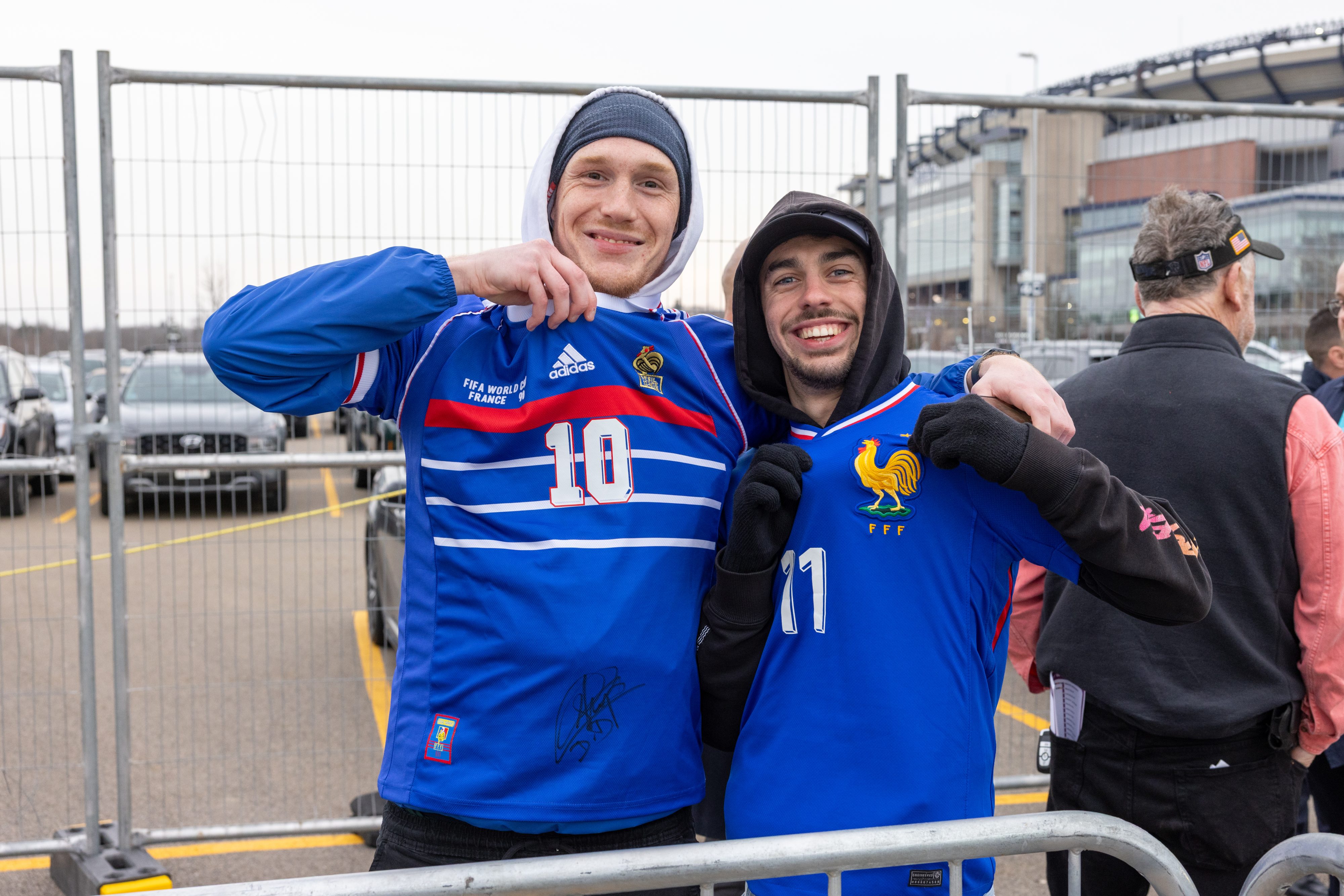 Two friends hugging before boarding the Commuter Rail for a match